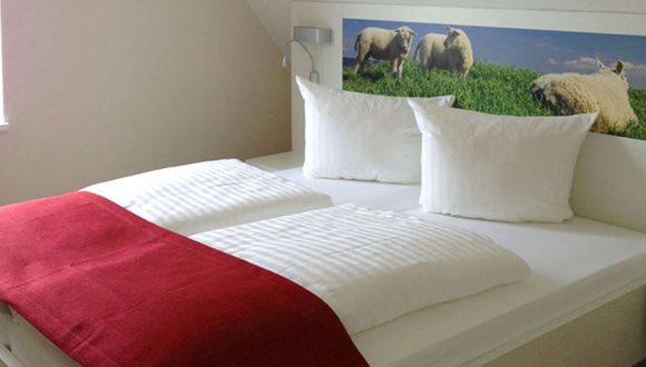 ein Schlafzimmer in der Familien-Suite Typ E