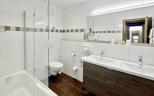 Family bathroom with a lot of storage and a bathtub not only for the small ones.