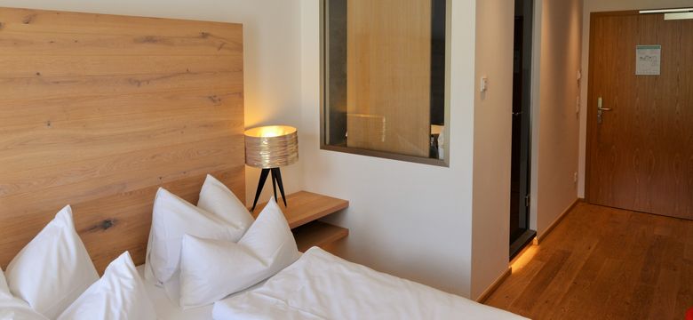 DAS GRASECK - mountain hideaway & health care: Basic room sunny side with balcony/terrace image #4