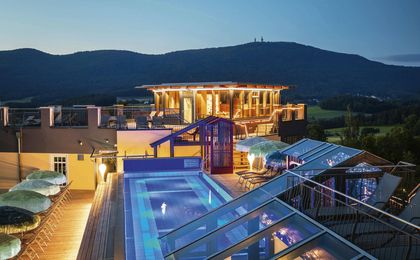 Rooftop pool deck after sunset
